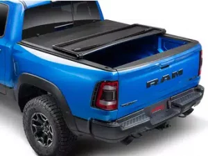 Extang Trifecta E-Series tonneau cover on a blue Dodge Ram 1500 pick up truck.